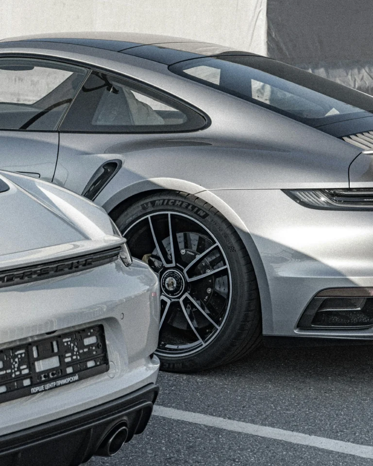 Two luxury sports cars parked side by side, showcasing precision, performance, and the rewards of strategic financial and asset planning.