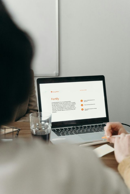 Orange Effect Fortify Plan displayed on laptop, showcasing advanced asset protection, irrevocable trust structures, and privacy-f