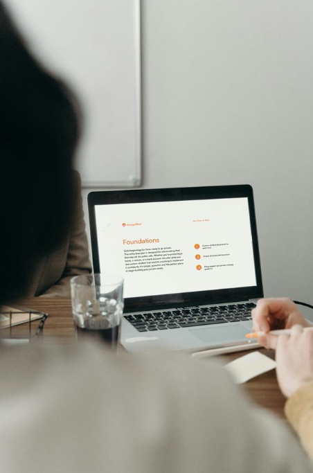 Orange Effect Foundations Plan displayed on laptop, illustrating entry-level asset protection, private trust setup, and wealth preservation for Bitcoin holders.